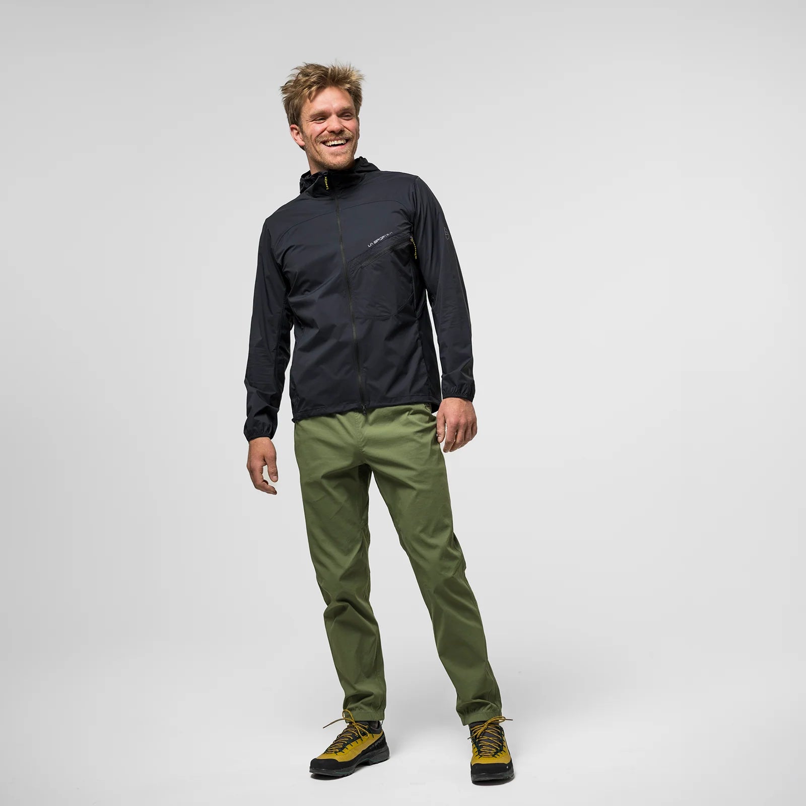 A man modeling La Sportiva Gambit Pant men's lightweight climbing pants